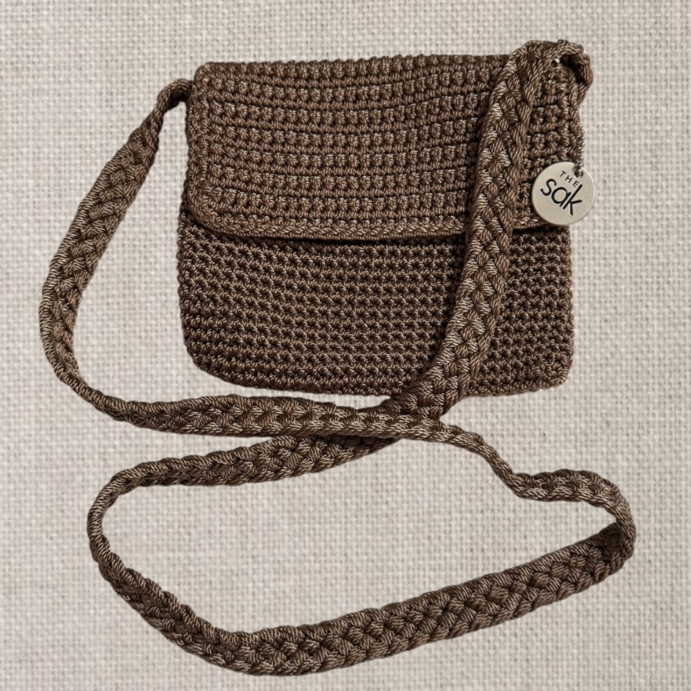 The Sak Brown Crochet Crossbody Bag with Charm Flap & Zipper Closure